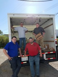 Clockwise from upper left: Business Rep. Jeff Rush, Training Coordinator Rob Gartner, Business Rep. Mike Tipton and Business Rep. Jeff Hunley load a truck with donations for Hurricane Irma relief. 
